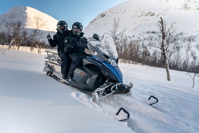 Adventure Snowmobile Safari - Riding through mountains, valleys, and frozen waterways
