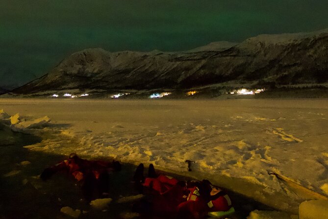 Arctic Ocean Night Floating in Ramfjord - Fire-warmed cinnamon buns and hot chocolate