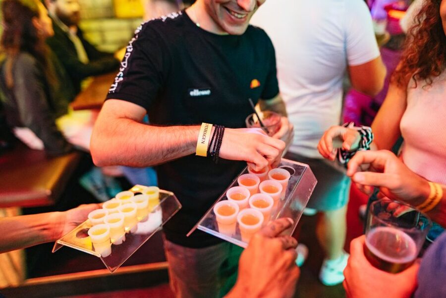 Copenhagen: Guided Party Pub Crawl with 4 Shots and 1 Drink - Walking between stops with a large international group