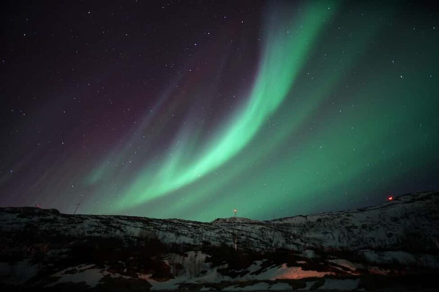 From Tromsø: Aurora Bus Tour with Snacks, Photos, and Drinks - What happens at the secret stop