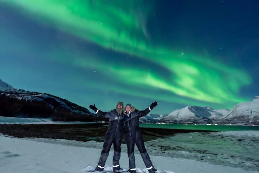 From Tromsø: Aurora Minibus Chase with Portrait and Hot Meal - Meeting at Ami Hotel and gearing up for the Arctic