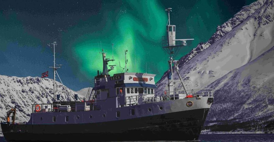 From Tromsø: Northern Lights Cruise on a Cozy Vintage Vessel - Sailing Tromsø’s fjord after dark