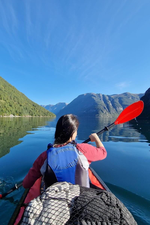Hellesylt: Beginner-Friendly Fjord Kayaking Experience - Following the shoreline beneath the mountains