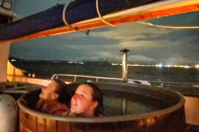 Luxury Northern Lights Yacht Cruise with Hot Tub from Tromsø - A hot tub in snow, wind, or starlight