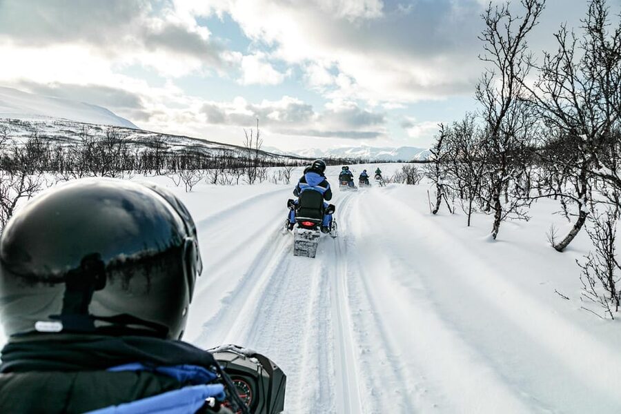 Lyngen: Snowmobile Safari with Lunch in seaside Restaurant - Sharing the machine and taking turns