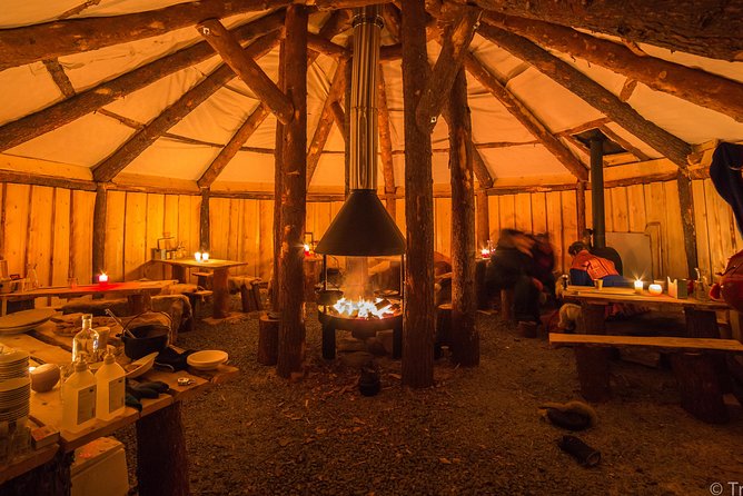 Night Reindeer Sledding with Camp Dinner and Chance of Northern Lights - Dinner inside a candlelit gamme
