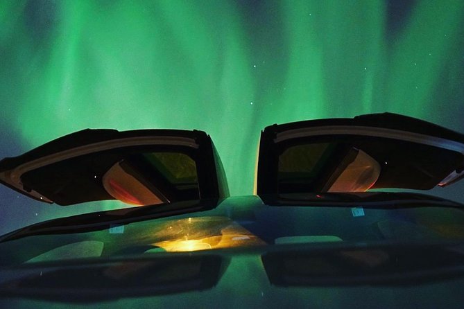 Northern lights - TeslaX Ecofriendly Car - A quiet electric start in central Tromsø