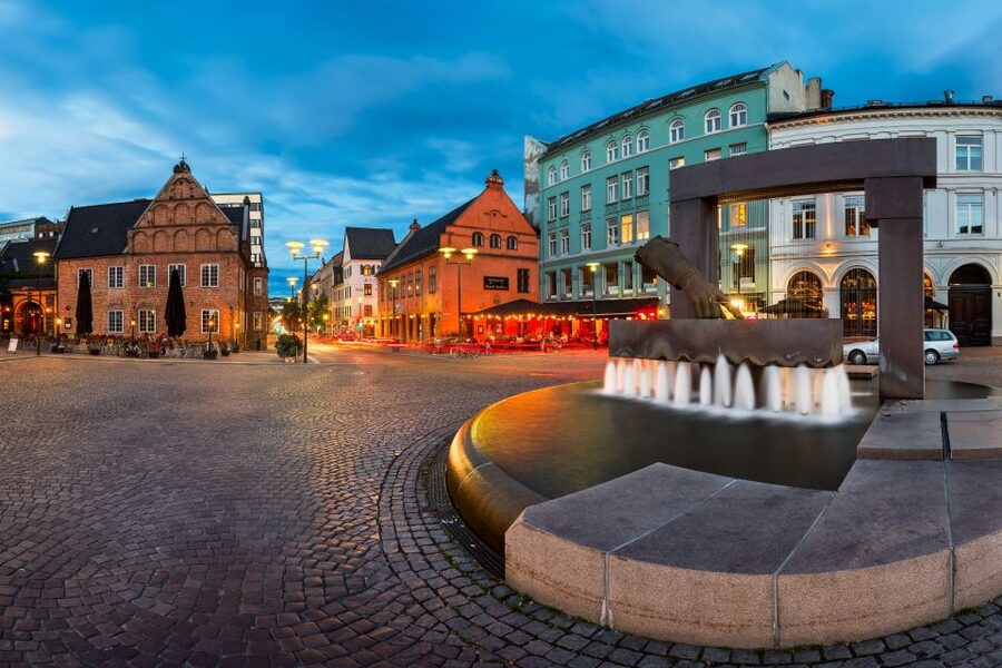 Oslo: Historic Myths & Legends Evening Walking Tour - Christiania Torv and the old city’s layered past