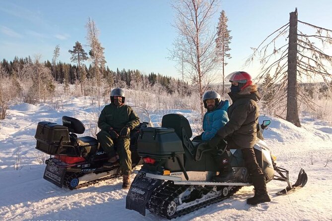Private snowmobile day tours - Leaving Vuollerim for the white forest