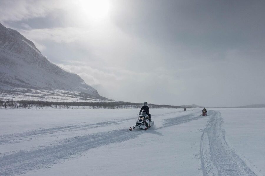 Snowmobile Adventure Abisko (Shared) - Riding through snowy trails and frozen scenery