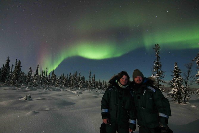 Snowmobile Aurora Expedition with dinner - A Lapland meal in a forest hut
