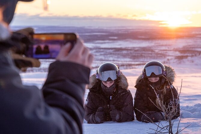 Snowmobile Safari to Lapland viewpoint - Coffee, fire, and ice fishing on a frozen lake