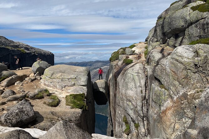 Stavanger Kjerag Hike with Guide and Transportation - Reaching Kjeragbolten above Lysefjorden