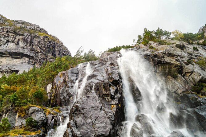 Stavanger: Waterfalls, Caves and Rock Tour By Sea - Waterfalls, spray, goats, and summer pasture