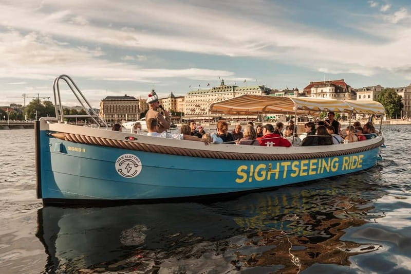 Stockholm: Guided City Sightseeing Open Electric Boat Tour - Meeting the blue boat beside the Royal Palace