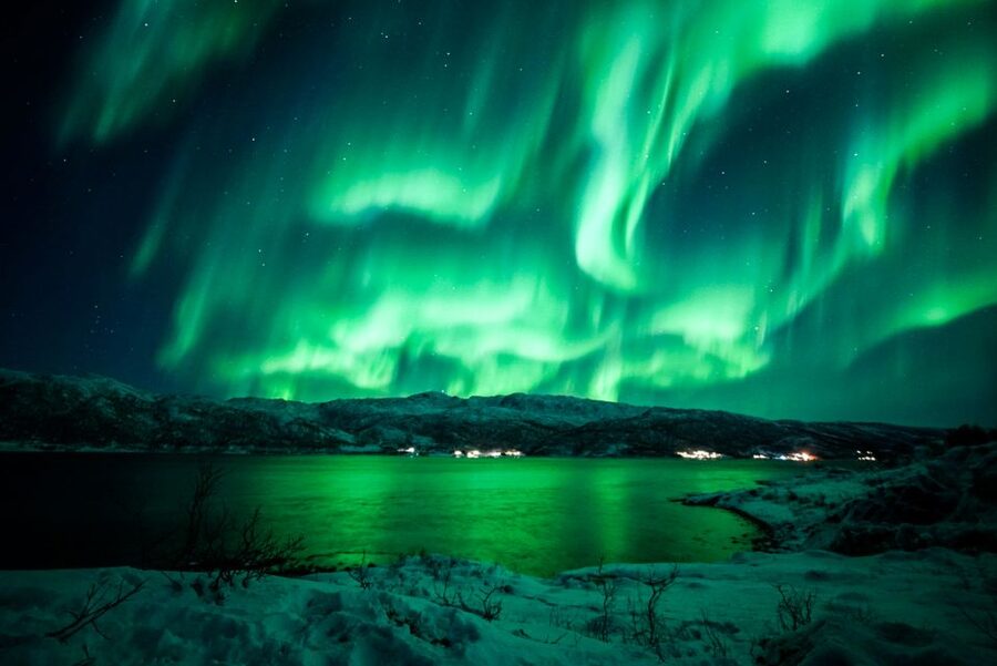 Tromsø: Northern Lights Chase Minibus Tour - Standing under the lights in the cold