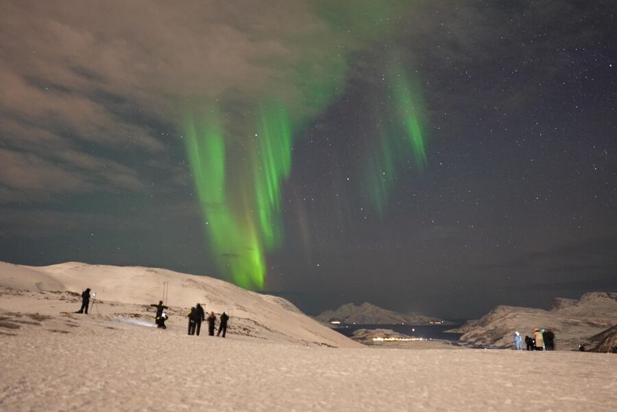 Tromsø: Northern Lights Minibus Small Private Tour Group - Staying warm beside the minibus
