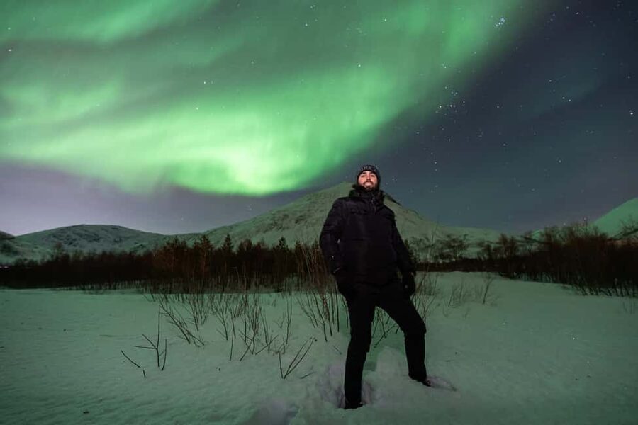 Tromsø: Northern Lights Tour with Professional Photographer - Waiting beneath the aurora with hot drinks and cookies