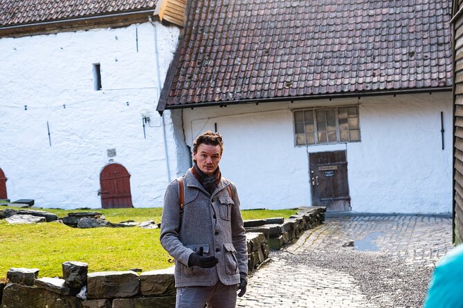 Walking Tour in Bergen of the Past and Present - Finishing by the Fish Market