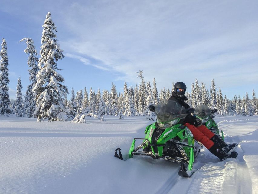 Wilderness Tour with Snowmobile & Ice Fishing - Learning to handle a two-person snowmobile